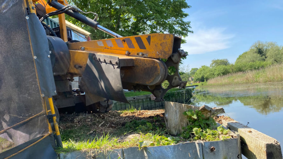 stump extraction equipment near river