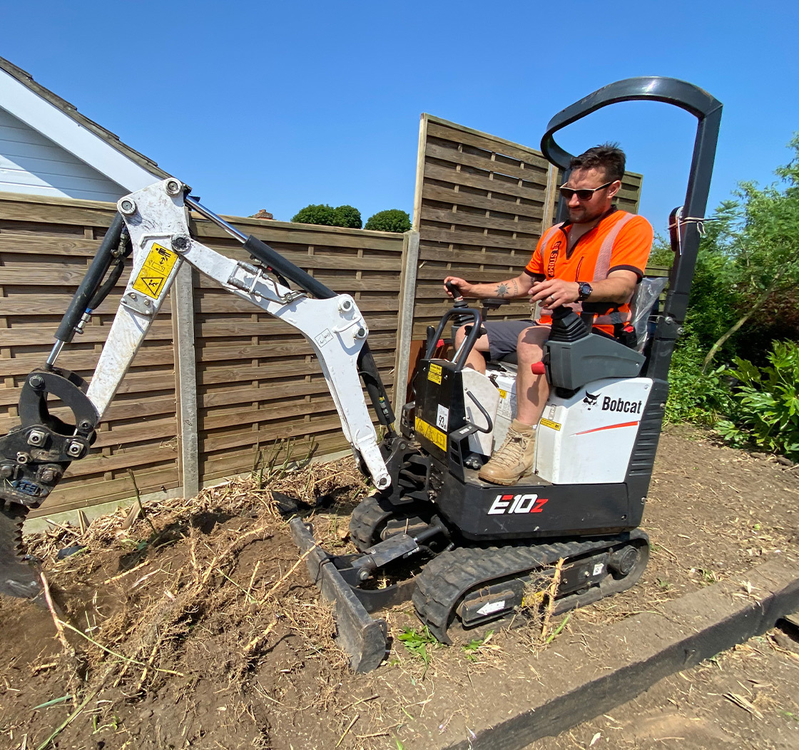 Employee excavating bamboo